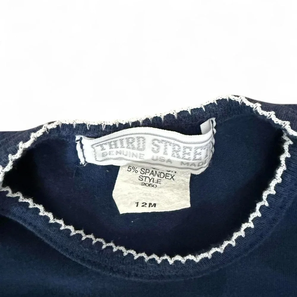 Navy blue BYU baby onesie with trim white stitching